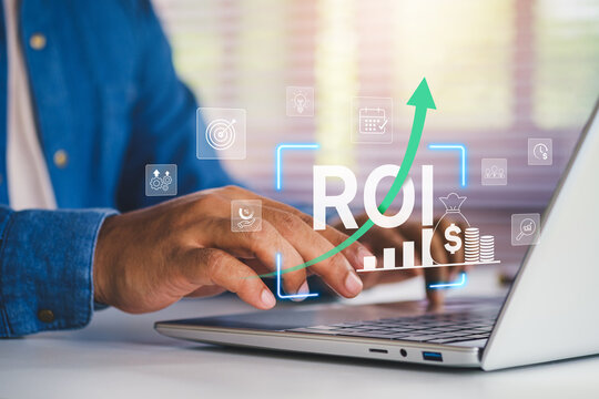 ROI strategy marketing performance, Businessman working on laptop with ROI return on investment growth analytics, digital financial performance metrics, revenue increase, marketing success dashboard - Powered by Adobe