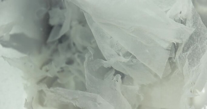 Paper shapes moving in clogged toilet flushing