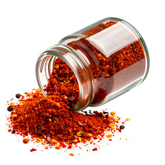 Glass jar tipped over, spilling red chili flakes & black peppercorns on a black background