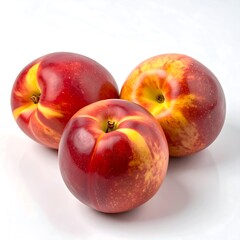 Three vibrant nectarines, arranged close together, on a white background