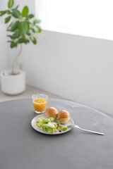 Healthy breakfast on table in bright white room