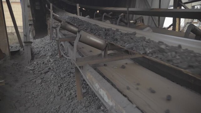 Closeup of conveyor belt transporting coal, Coal preparation plant in Bokaro, Jharkhand