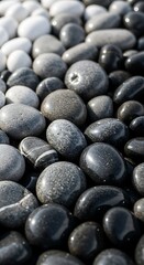 Harmonious zen: A balanced composition of smooth river stones in grayscale shades evoking tranquility and balance