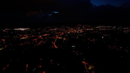 A Stunning Night View of a Cityscape Featuring Beautiful Illuminated Streets and Buildings