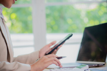Attentive businesspeople study documents on clipboards, collaborate with colleagues to solve problems, strategize, and find creative career solutions.