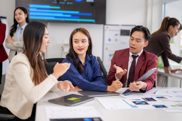 Business team discussing project strategy during meeting in modern office