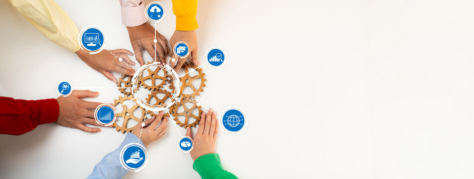 This image showcases a diverse group of hands collaborating around gears and icons, symbolizing teamwork and strategic planning in a modern business context. Amity