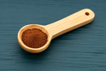 Organic dry coffee in a measuring spoon - Coffea