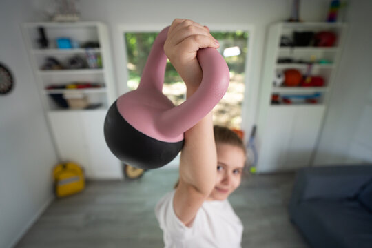 Kid practicing sport at home. Cute little boy doing morning fitness. Young sporty kid sport exercising in room. Child sport. Kids sport concept. Kid enjoying fitness training indoors. - Powered by Adobe