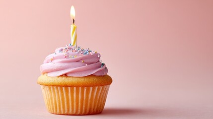 cupcake. A solitary birthday cupcake topped with frosting and a candle, set against a soft pastel backdrop. symbolizing life milestones and joyful moments.