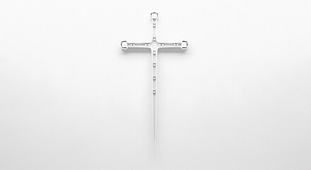 A minimalist white cross with small metal accents on a plain white background in a centered shot