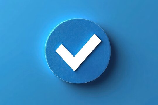 Blue circular button with a white checkmark symbol on a smooth blue background representing confirmation or verification