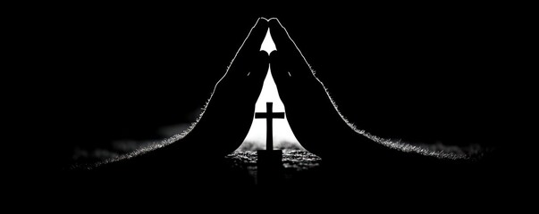 Silhouette of two hands forming a praying gesture around a small cross with bright light behind, evoking reverence and solemn spirituality