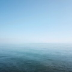 Minimal calm ocean horizon under clear blue sky with smooth water surface, symbolizing peace, balance, and natural tranquility perfect for meditation, relaxation, and serene background design
