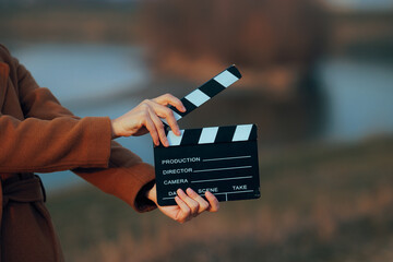 Filmmaker Shooting a Movie Outdoors in Autumn Scene. Cinematic frame for a movie documentary shot...