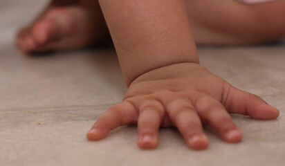 tiny hands and legs of toddler baby