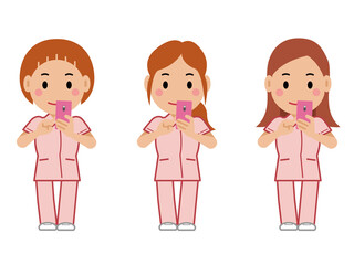 スマホを操作するピンクの制服の女性看護師。その2