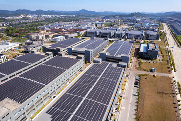 Aerial view of industrial park with solar panels on rooftops