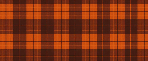 Obraz premium Seamless brown and orange plaid pattern in autumn tones cozy rustic fabric texture textile design