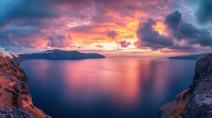 Breathtaking sunrise panorama of santorini island in greece with dramatic colorful sky and whitewashed cliffside houses overlooking the aegean sea