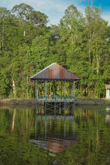 Obraz premium view a wooden tower on the riverbank as a background