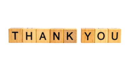 Wooden blocks spell out the phrase "THANK YOU" in bold black letters.