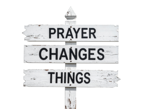 A weathered wooden sign displays the inspirational message: "Prayer Changes Things," emphasizing the power of prayer in life.