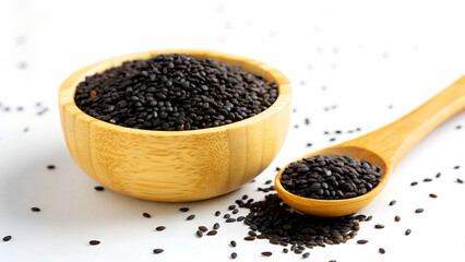 Black sesame seeds in a wooden bowl and spoon isolated on white background, highlighting their texture and use in various cuisines