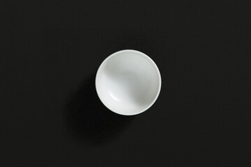 Sauce bowl on dark background