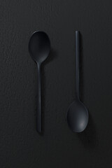Black spoon on dark background