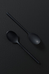 Black spoon on dark background