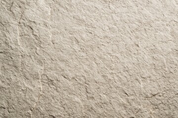 Fototapeta premium Beige stone textured surface background with rough natural details under soft light, ideal for creative design and organic material concepts. Ai generative