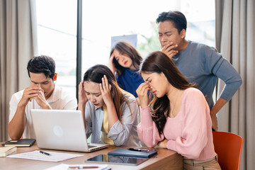 Frustrated upset business team people sad with bad work result, disappointed in failure crisis ,worried of problem sit at table at office meeting.