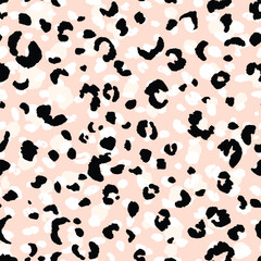 Abstract modern leopard seamless pattern. Animals trendy background. Beige and black decorative vector stock illustration for print, card, postcard, fabric, textile. Modern ornament of stylized skin.
