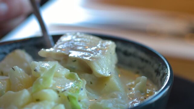 Spoon Lifting Chunky Haddock from Creamy Scottish Soup