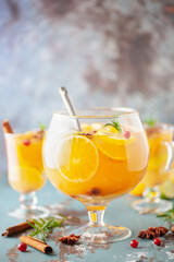 Homemade hot alcohol mulled apple cider punch with cinnamon sticks, anise star and spices