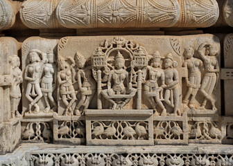 Detail intricate sculpture of traditional Hindu architecture on historic Jain temple in Ranakpur, Rajasthan, India.