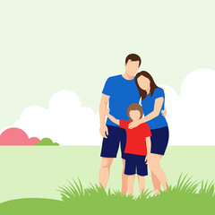A happy family with parents and a child standing in a grassy field with a cloudy sky.