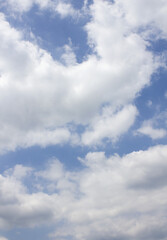 Blue sky with puffy clouds