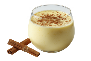 Creamy yellow drink in glass with cinnamon sticks and spice isolated on a transparent background beverage
