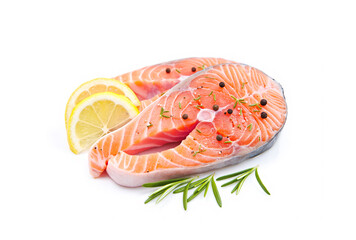 Fresh salmon steaks, spices and lemon slices on white background