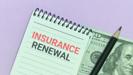 Obraz premium Insurance renewal notice on notepad with hundred dollar bill and pencil on desk top