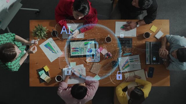 A high-angle view of a diverse group of professionals engaging in a collaborative meeting, utilizing AI technology and digital tools for innovative planning and strategy development. Raster