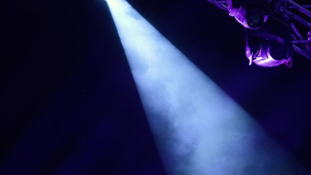 LED Light Concert on the stage 4K. Close up shot of the light with cinematic smoke passing through it.