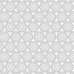 Intricate black and white geometric pattern with repeating circular mandala motifs and subtle dot textures