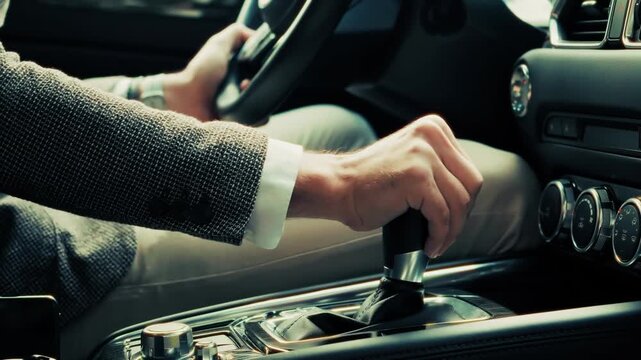 Driver operating manual transmission . Modern vehicle driving . Luxury car