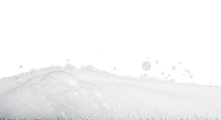 Close up of white foam texture with soap bubbles and water drops isolated on transparent background