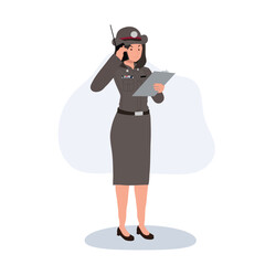 female police officer using radio and writing report in uniform for law enforcement and security duties in thailand