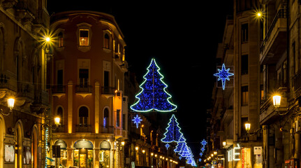 Night Christmas street with beautiful decoratoins during New Year holidays, urban cityscape for 2025 New Year