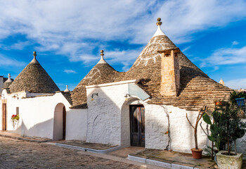 old mediterranean architecture buildings trulli in Alberobello, Italy. Landmark with traditional ancient houses with white walls.